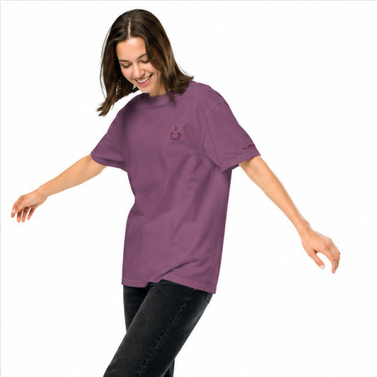 Female model wearing the berry Poured for This coffee T-shirt by Klemm & Co., angled left to show the embroidered coffee cup design in maroon thread on the front.