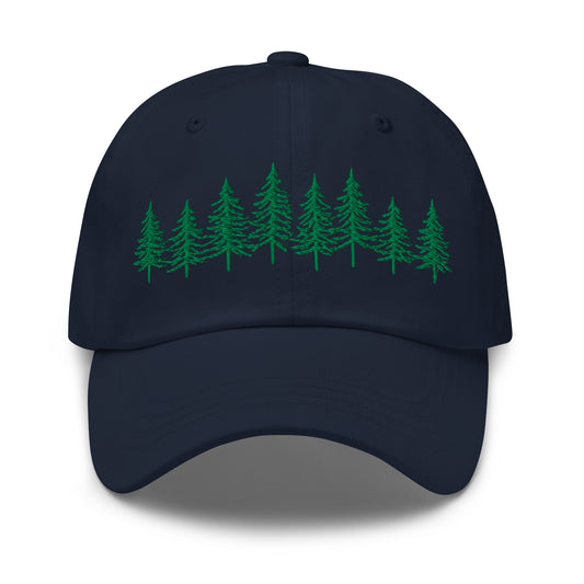 Navy Into the Pines baseball hat by Klemm & Co., featuring the embroidered pine tree design on the front in green thread.