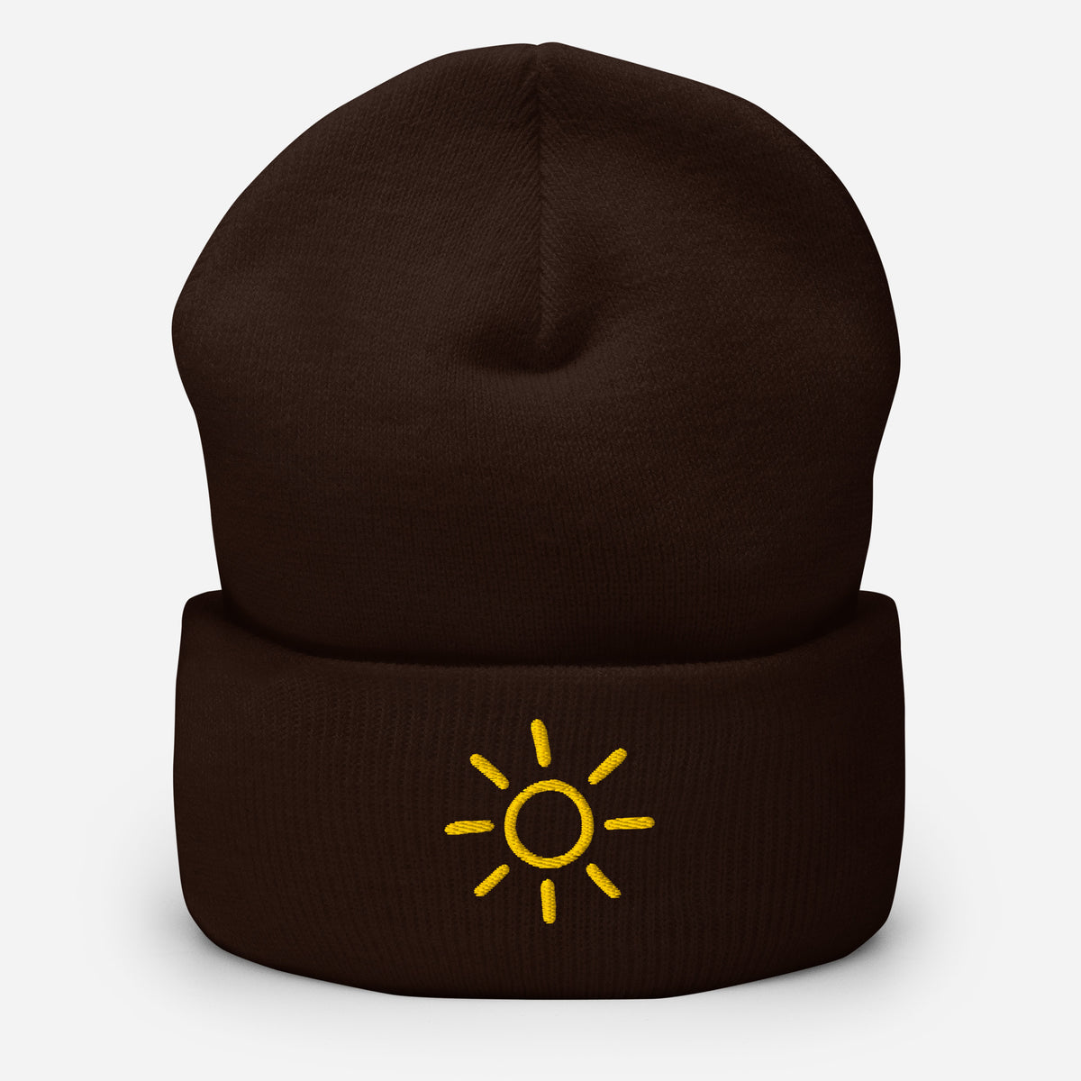 Brown Sun embroidered toque by Klemm & Co., featuring a minimalist sun design embroidered in gold thread.