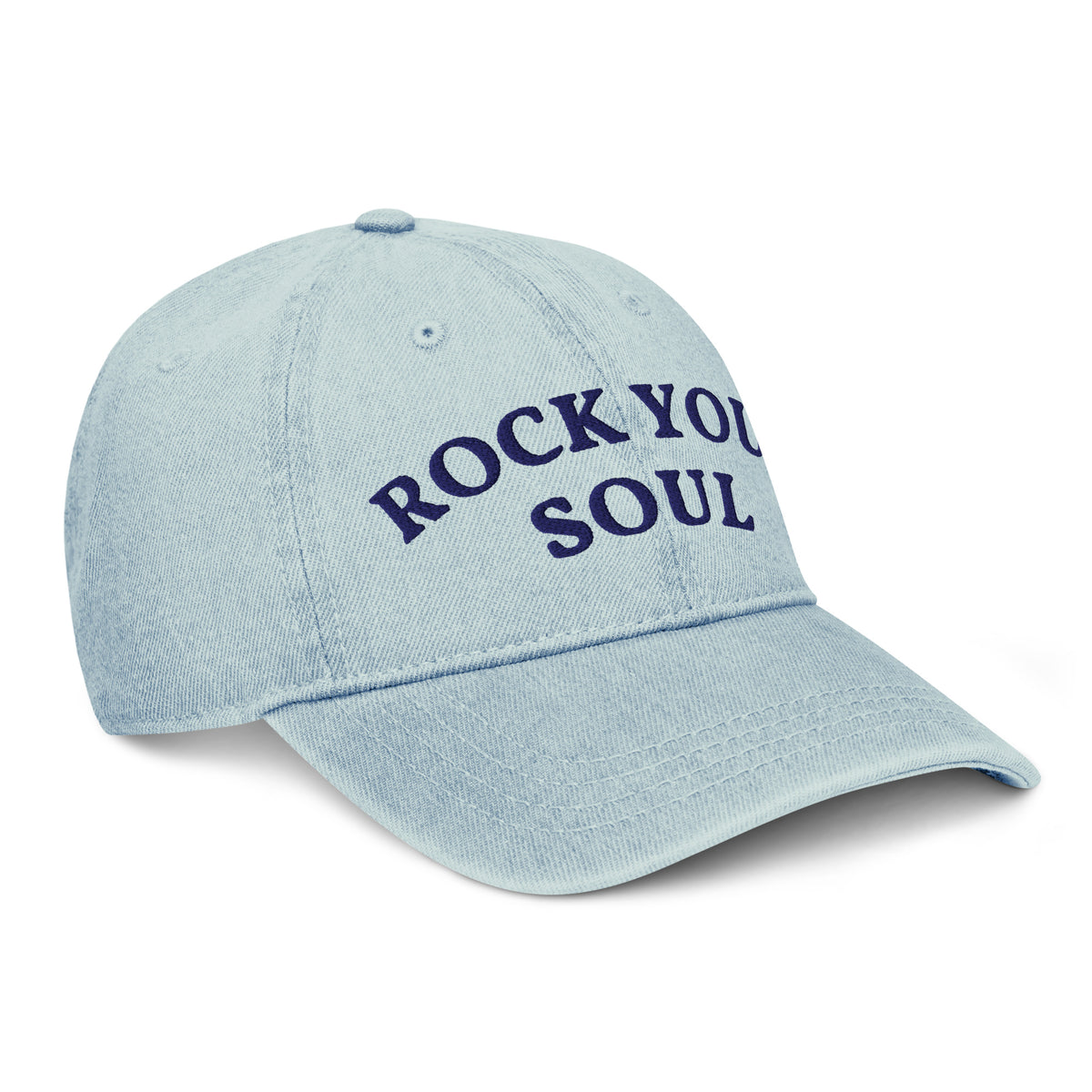 Front-left view of the light blue denim Rock Your Soul baseball hat by Klemm & Co., showing ROCK YOUR SOUL embroidered in navy thread.
