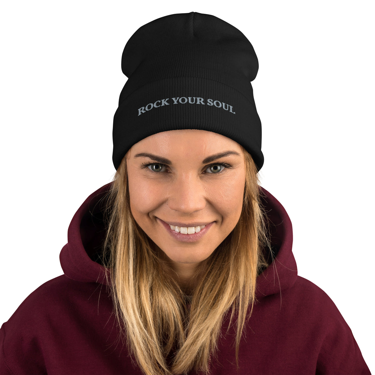 Female model wearing the black Rock Your Soul toque by Klemm & Co., front view showing ROCK YOUR SOUL embroidered in grey thread.