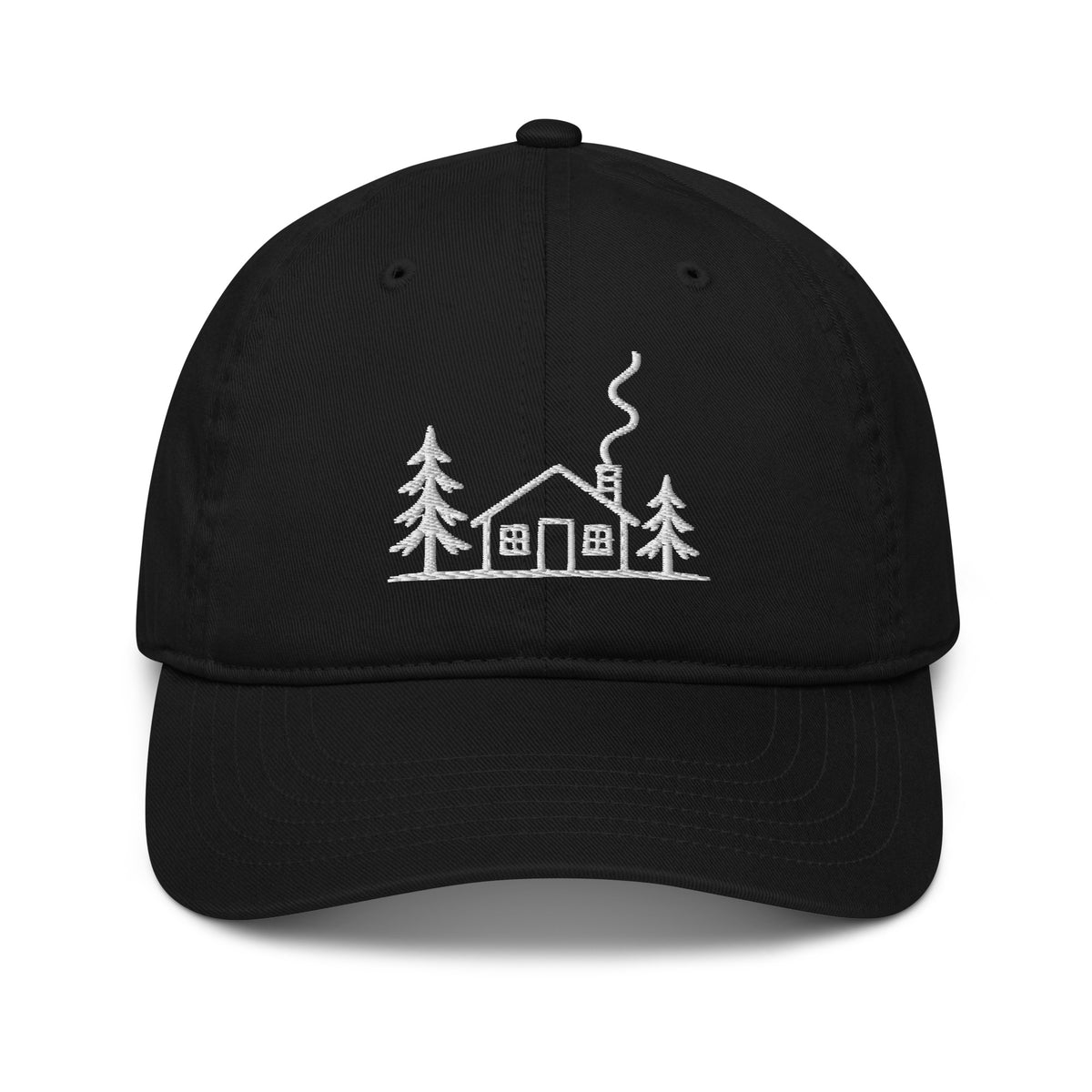 Black Meet Me at the Cabin baseball hat by Klemm & Co., featuring white embroidered cabin and pine tree artwork.