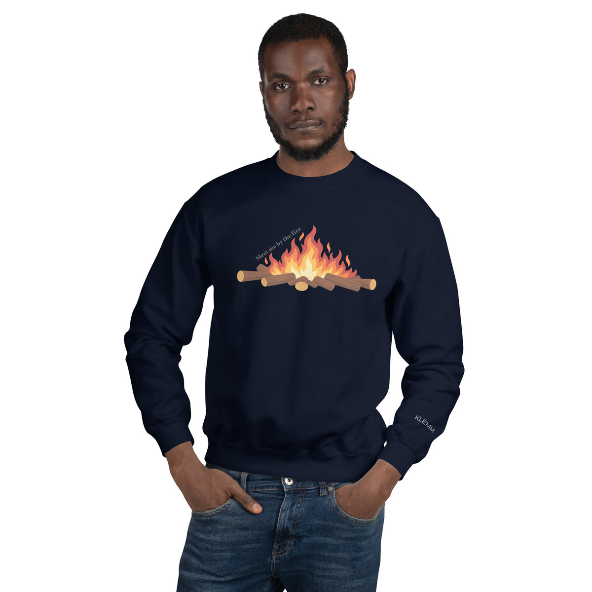 Male model wearing the navy Meet Me by the Fire crewneck sweatshirt by Klemm & Co., front view showing the printed campfire design.