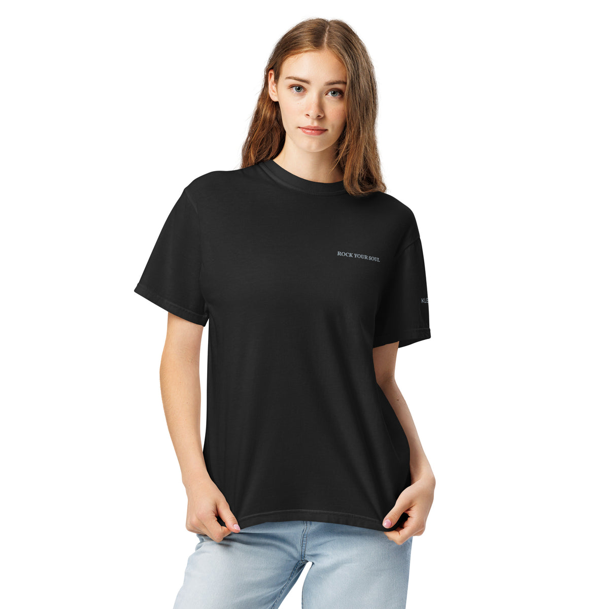 Female model wearing the black Rock Your Soul T-shirt by Klemm & Co., front view showing ROCK YOUR SOUL embroidered in grey thread.