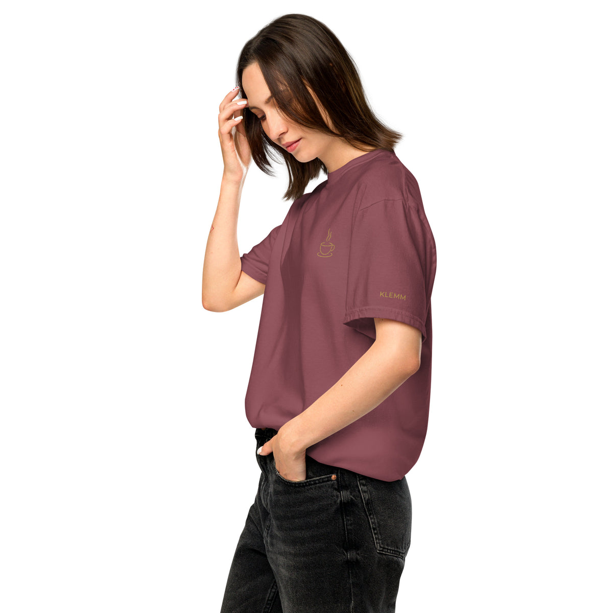 Female model wearing the brick Poured for This coffee T-shirt by Klemm & Co., left side view showing KLEMM embroidered in gold thread on the sleeve.