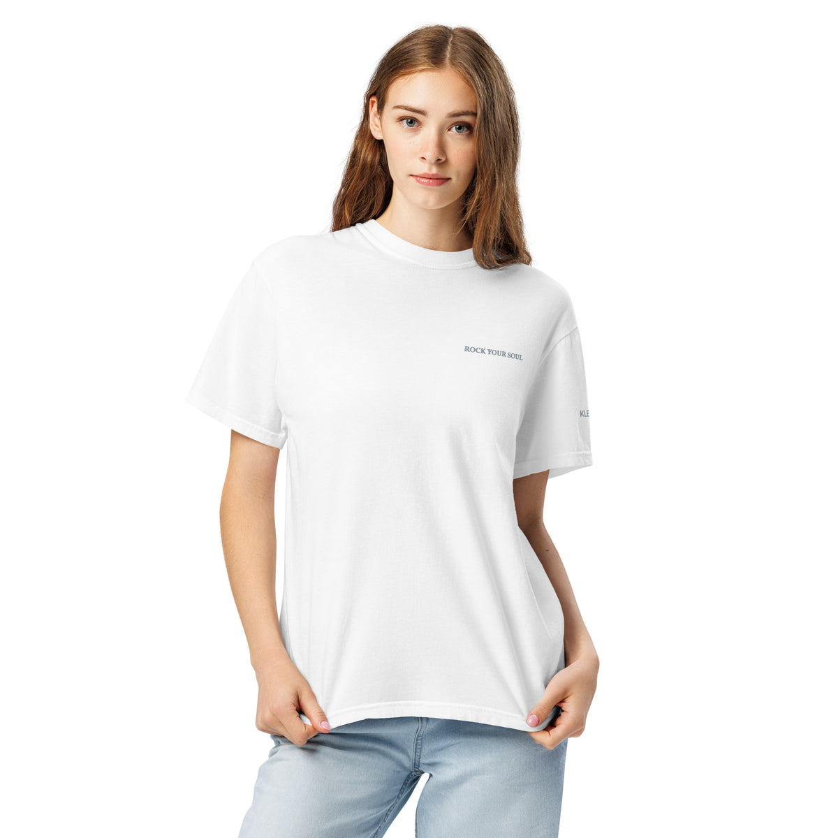 Female model wearing the white Rock Your Soul T-shirt by Klemm & Co., front view showing ROCK YOUR SOUL embroidered in grey thread.