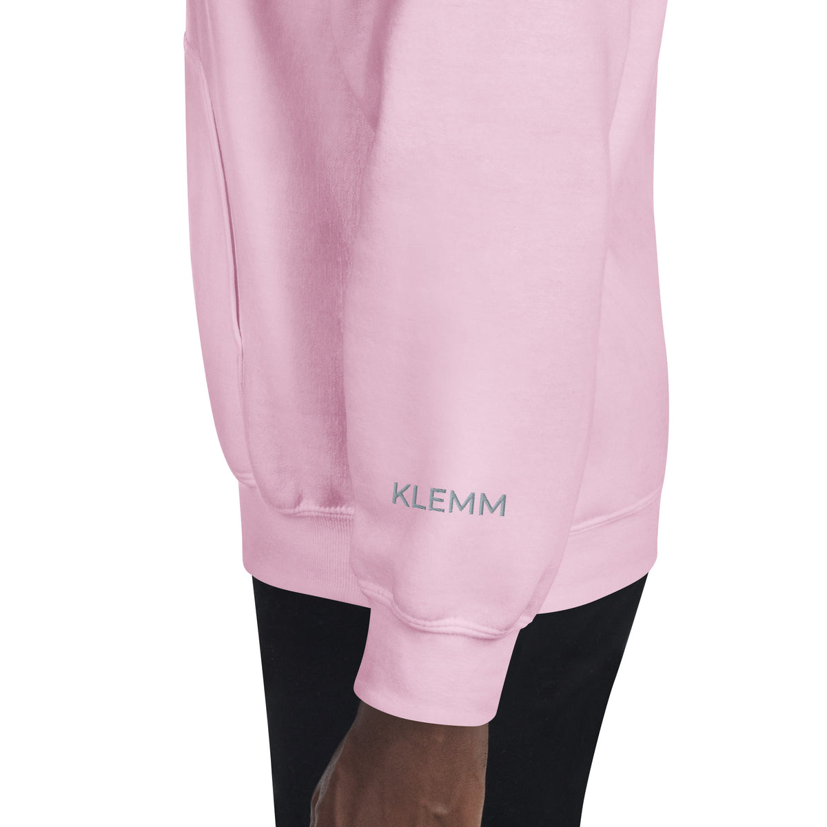 Left side view of the light pink Into the Pines embroidered hoodie by Klemm & Co., showing KLEMM embroidered in grey thread on the sleeve.