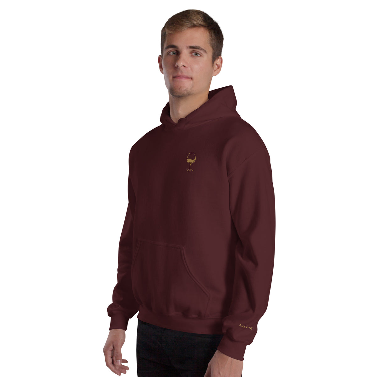 Male model wearing the maroon Poured for This wine hoodie by Klemm & Co., showing the gold embroidered wine glass on the front and KLEMM sleeve branding.