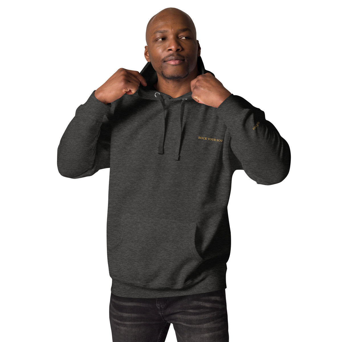 Male model wearing the charcoal Rock Your Soul hoodie by Klemm & Co., front view showing ROCK YOUR SOUL embroidered in gold thread.