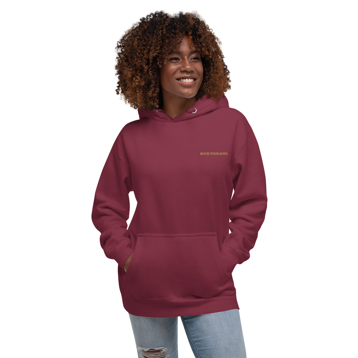 Female model wearing the maroon Rock Your Soul hoodie by Klemm & Co., front view showing ROCK YOUR SOUL embroidered in gold thread.